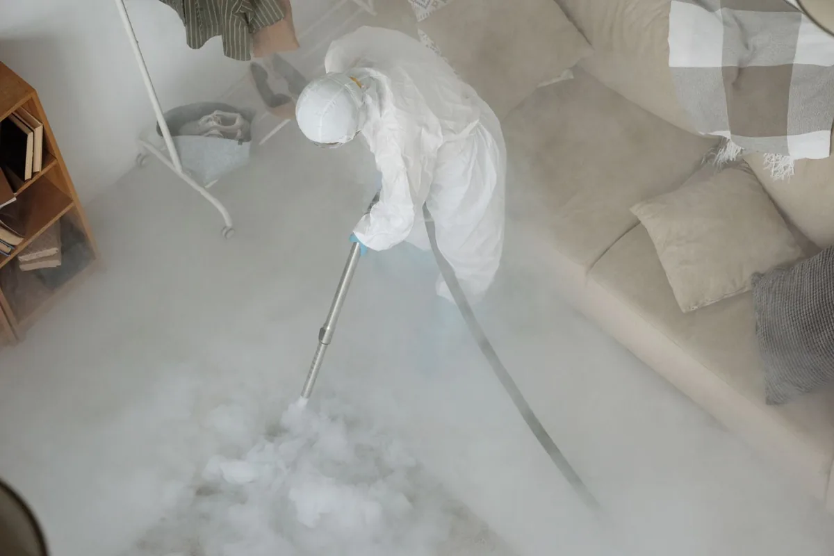 Biohazard cleanup technician in protective equipment, Roosevelt, UT